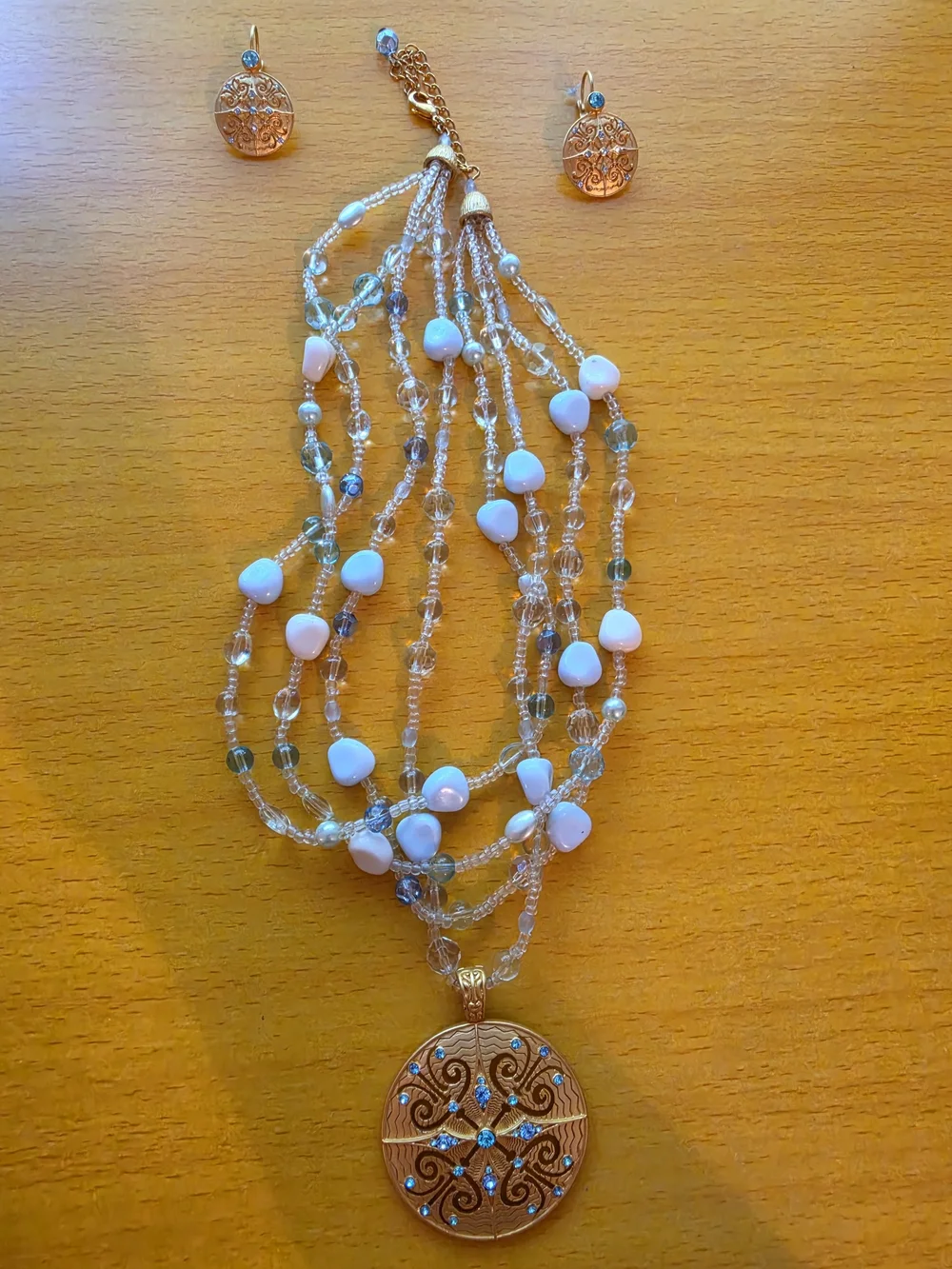 Avon By Nina Ricci Gold-Tone Pendant Necklace with White, Blue and Clear Accents